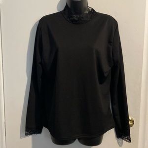 Black long sleeved top with lace at neck and end of sleeves